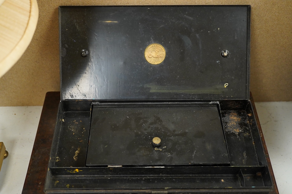 Three early to mid 20th century artist’s paint boxes, one tin box with Winsor and Newton label to the inside of the lid, plus a Rowley labelled box, a wooden paint box- 39cm wide, together with a leather pencil case, the